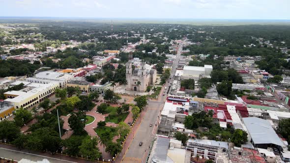 Aerial orbital shot of park in downtown valladolid Mexico