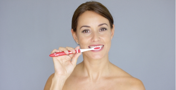 Healthy Young Woman Cleaning Her Teeth