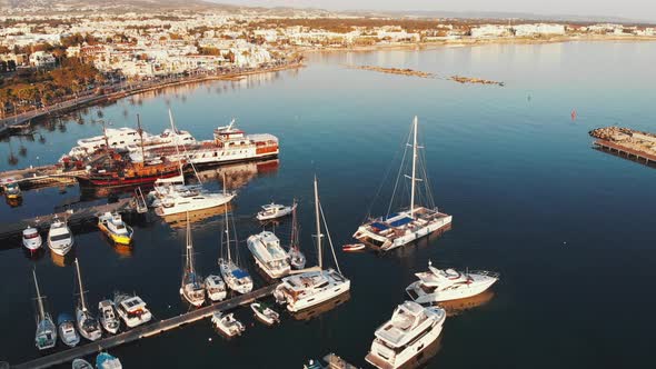 Aerial Top View of Marina Bay with Piers and Sail Ships Fisherman Boats and Motorboats Floating