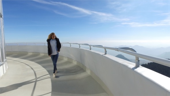 Beautiful Girl Walking in a High Tower