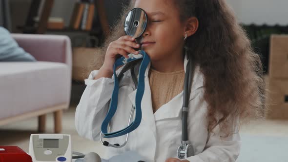 Cute 8-Year-Old Girl Playing Doctor and Posing