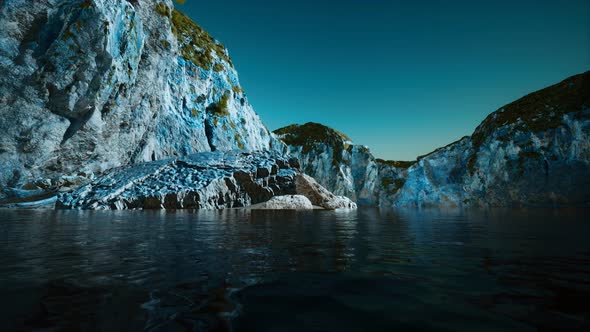 Rocky Cliff at Cold Sea Water