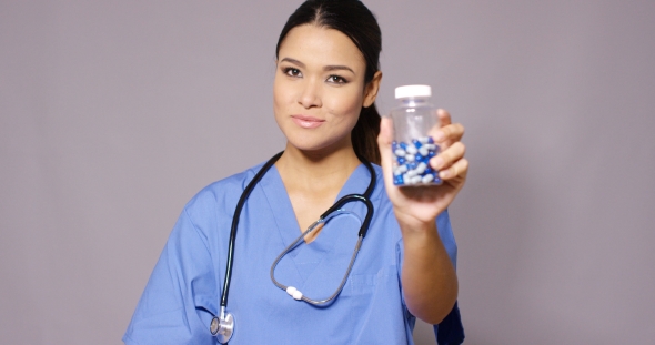 Nurse Reminding a Patient To Take Their Medication