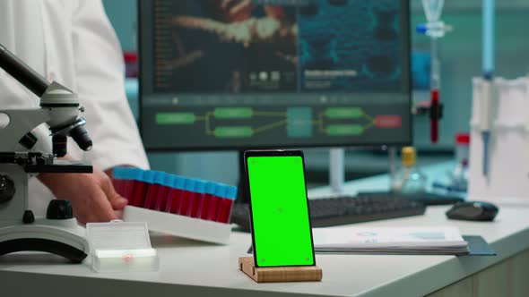 Smartphone Working in Laboratory with Chroma Key Display