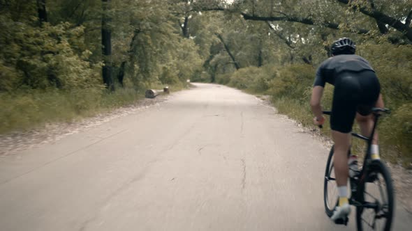 Cyclist Riding On Carbon Bike In Lycra Sportswear. Muscular Fitness Biker Cycling Workout. Bicycle.