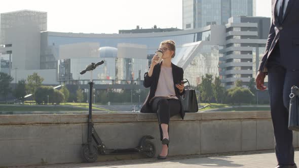 Woman With E-Scooter Chilling Outside