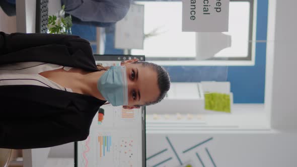 Vertical Video Portrait of Woman Manager Wearing Face Mask to Prevent Infection with Coronavirus