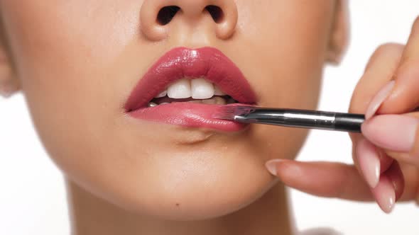 Fashion Woman Makeup Beauty Lips. Close-up of the Lips. Lipstick Ads