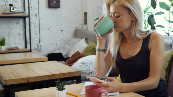 The Girl Is Writing a Message in the Phone