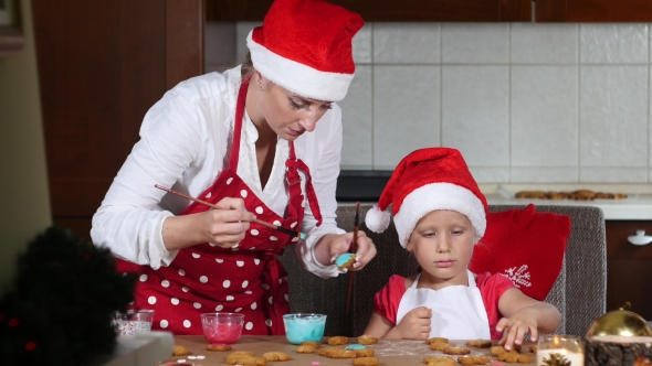 Mother And Daughter Are Preparing Gingerbread For Christmas