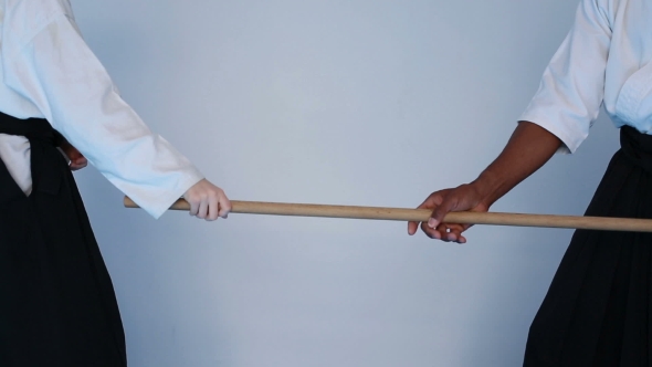 Two Persons In Black Hakama Practice Aikido On Martial Arts Training