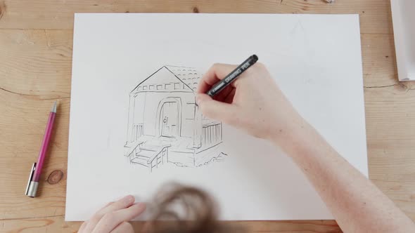 Timelapse of artist drawing a house