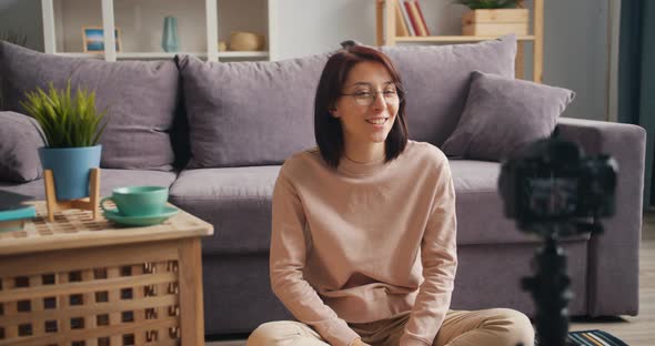 Pretty Young Woman Vlogger Recording Video for Online Blog Talking Gesturing