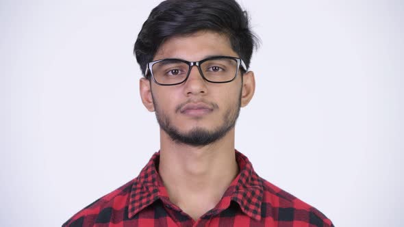 Young Handsome Bearded Indian Hipster Man Wearing Eyeglasses
