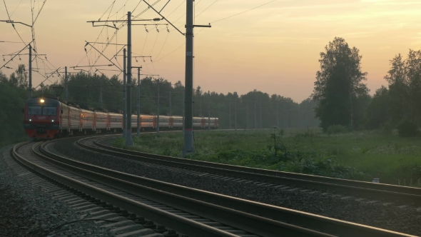 Train Turning And Passing By Outside The Town