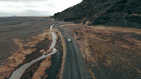 Car Moving On Curvy Mountain Road