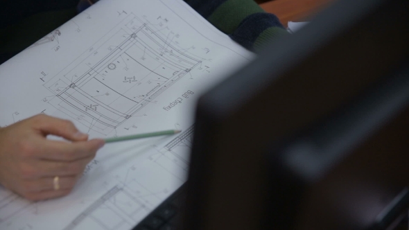 Male Architect Working With Blueprint During Planing Construction alt