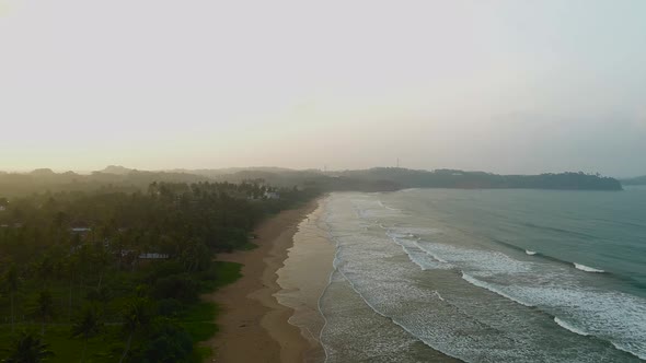 Panning A Tropical Coastline At Sunset