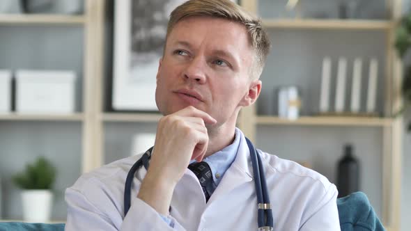 Pensive Doctor Thinking About Patient Health