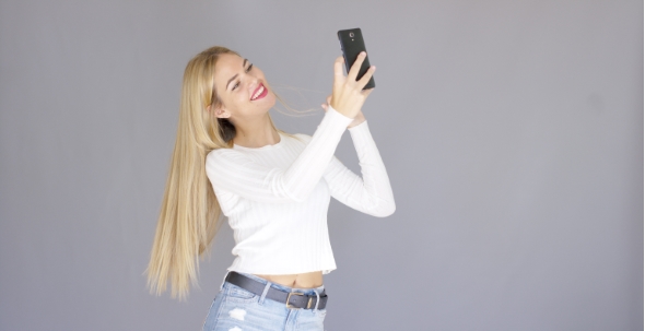 Fun Sexy Young Woman Posing For a Selfie