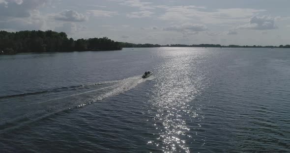 Motorboat at full speed on a lake