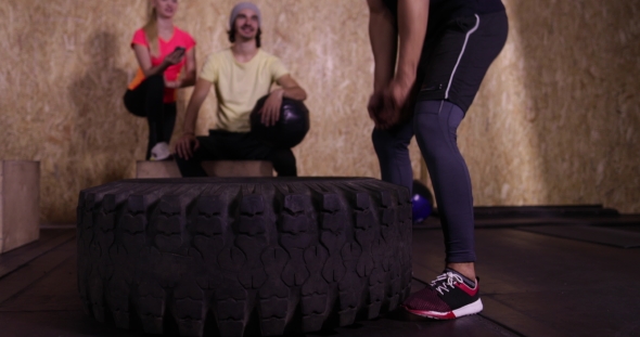 Man In Gym Sport Exercising Guy Flipping Big Tire Crossfit Training, Sportsman Working Out