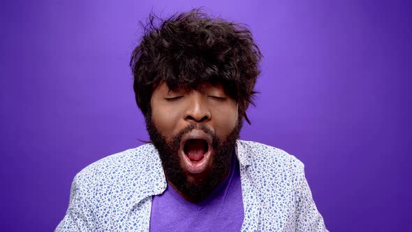 Shocked Amazed Young Bearded Black African American Man Purple Background