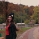 Girl With a Long Hair, Black Hat And Backpack Runs Cross The Urban Autumn Park, Turns To Camera And - VideoHive Item for Sale