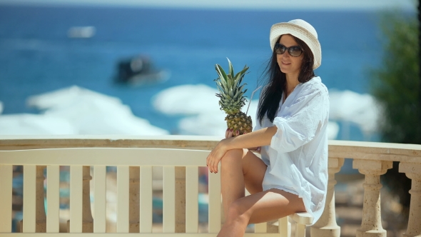 Pretty Woman In White Hat With Tropical Cocktail