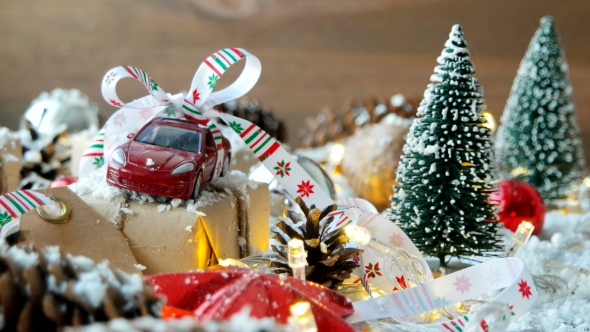 Christmas Background With Toy Car Present With Ribbon and Balls