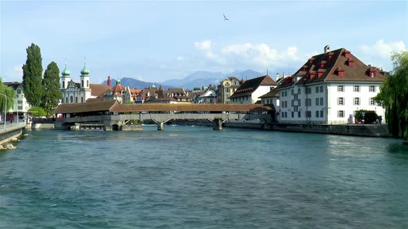 Spreuer Bridge over the Reuss River in Luzern, Lucerne, Switzerland. Jesuit Church in background,