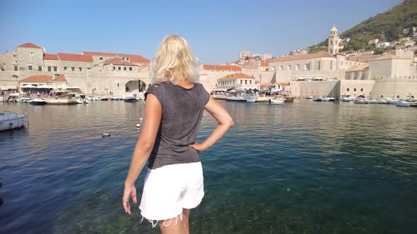 Woman in Old Medieval Port in Croatia