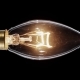 Candle Shaped Lamp Light Bulb Flickers Over Black Background - VideoHive Item for Sale