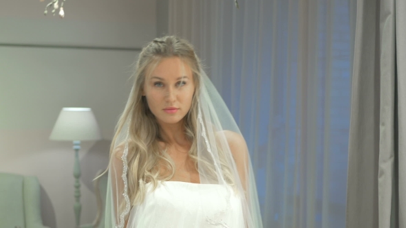 Blonde Girl Posing On Camera In Wedding Salon