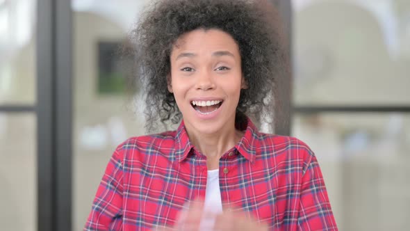 Portrait of Excited African Woman Celebrating Success