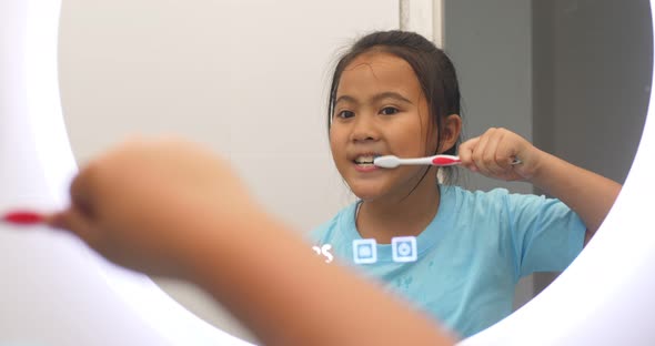 Girl Brushing Teeth