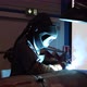 A worker is welding in his industry. - VideoHive Item for Sale
