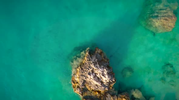 Aerial view of set of rocks near seashore in Greece.