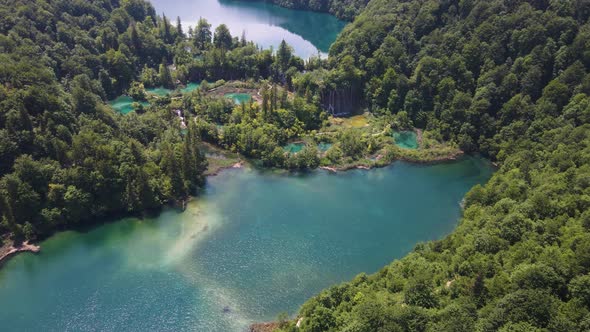Top view of the Plitvice Lakes National Park with lots of green plants and beautiful lakes and waret