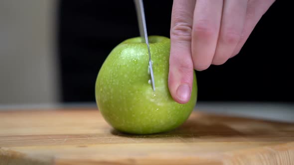Female Hand Cut Apple Slice on Wooden Chopping Board View of Cutting Apple Slices on Chopping Board