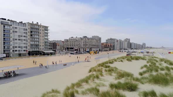 People walk and enjoy in summertime in scenery town near the Belgian beach, Nieuwpoort, Belgium