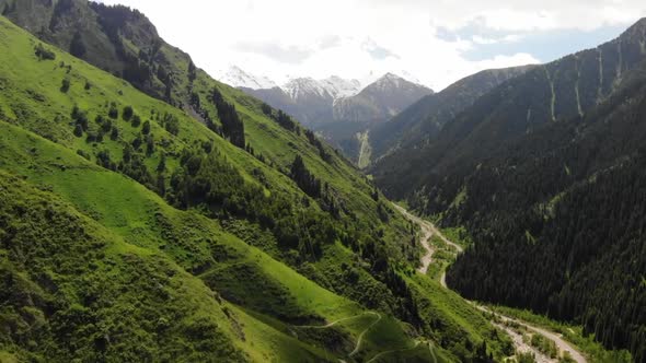 A beautiful green trail in the mountains of the Trans-Ili Alatau. Aerial video. Japanese Road.