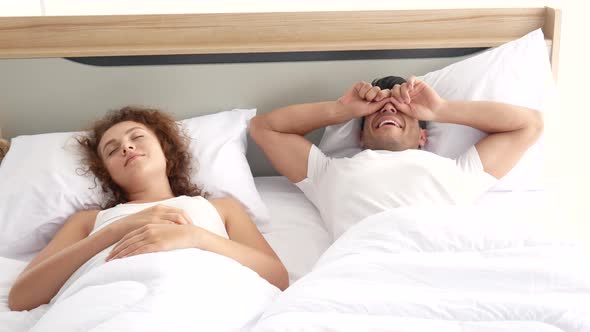 Couple lover wake up then man hug his girl on bed in the morning in bedroom