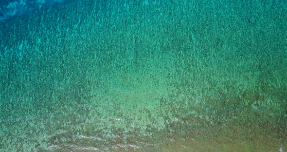 Beautiful drone copy space shot of a summer white paradise sand beach and blue water background 