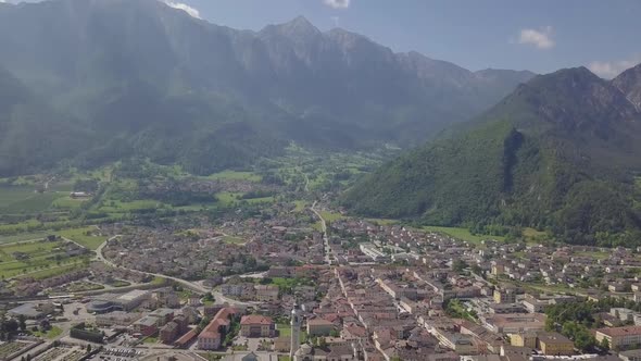 Aerial panoramic view of Borgo Valsugana in Trentino Italy with views of the city and mountains, cam