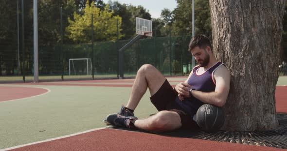 Young Basketball Player Checking His Activity on Smartwatch