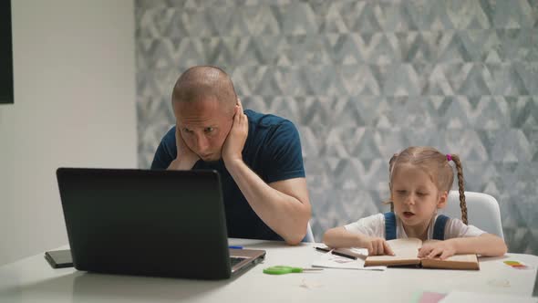 Father Tries To Concentrate Daughter Does Homework at Table