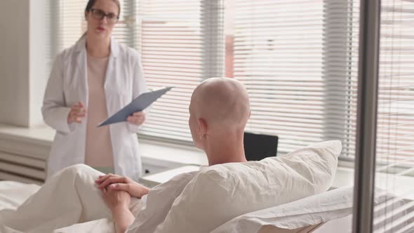 Doctor Telling Bad News to Patient with Oncology