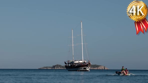 Yacht With Tourists Infront of the Island