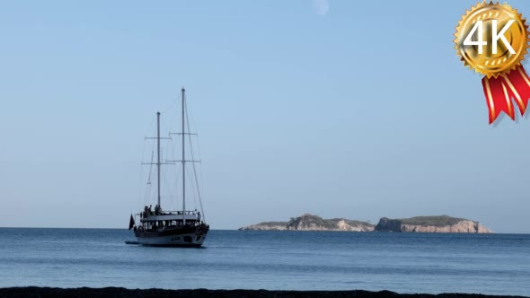 Yacht With Tourists Infront of the Island